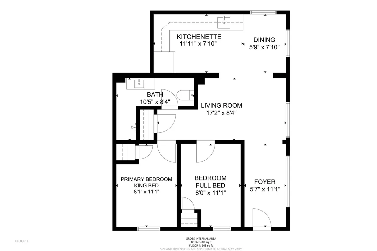 This image displays a thoughtfully arranged open-plan interior that seamlessly connects the kitchenette, living room, primary bedroom, bath, and dining area. With inviting lighting and a cozy, functional layout, the space radiates the feeling of a recently remodeled, modern haven. Visible durable flooring and chic yet practical furnishings evoke a welcoming atmosphere ideal for relaxation or social gatherings.